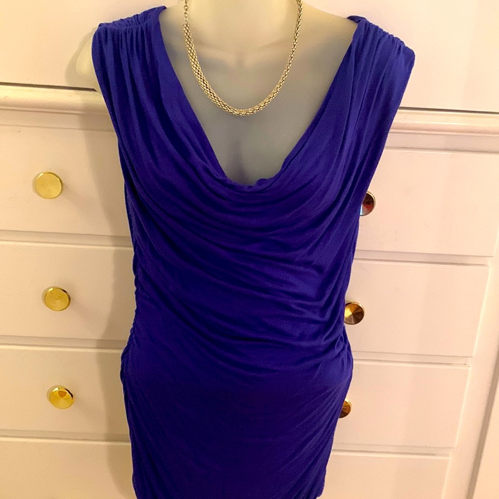 H & M Purple top that is exquisite looking on goes with any outfit!
